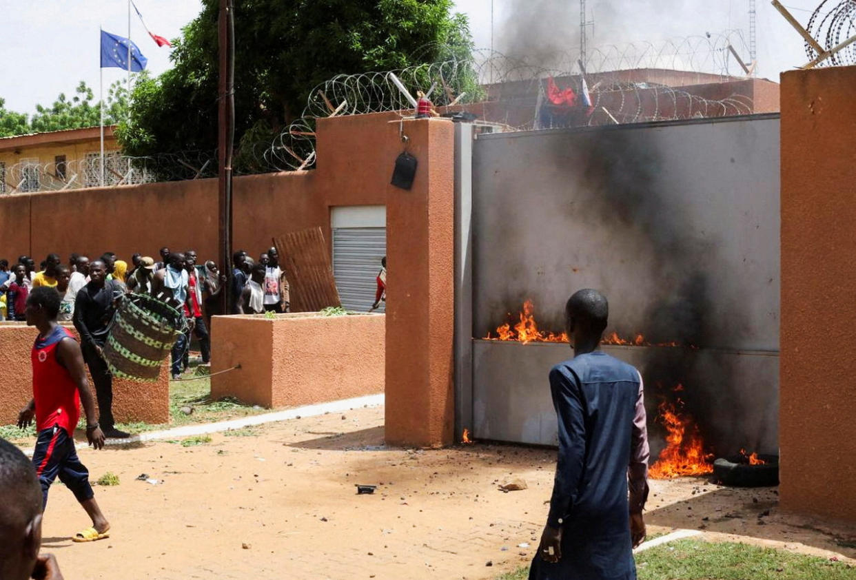 Pro-junta demonstrators set the French Embassy in Niamey on fire.