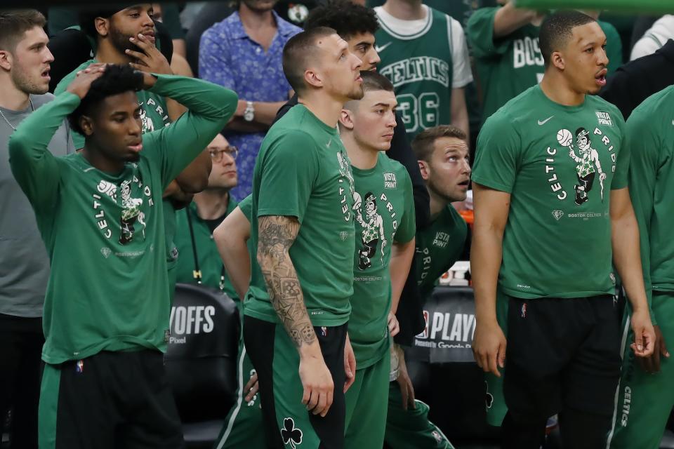 The Boston Celtics bench watches play during the second half of Game 6 of the team's NBA basketball playoffs Eastern Conference finals against the Miami Heat, Friday, May 27, 2022, in Boston. (AP Photo/Michael Dwyer)