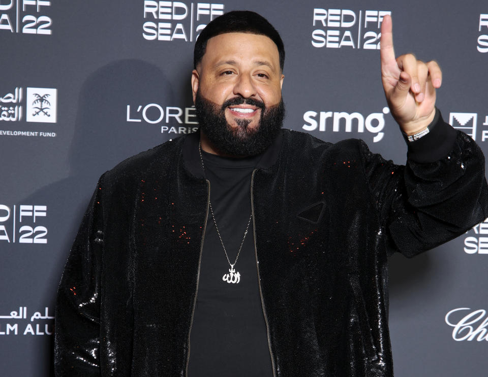 <p><a href="https://people.com/tag/dj-khaled/" rel="nofollow noopener" target="_blank" data-ylk="slk:DJ Khaled;elm:context_link;itc:0;sec:content-canvas" class="link ">DJ Khaled</a> wears a shiny jacket and equally shining smile to the Dec. 8 Closing Night Gala for the Red Sea International Film Festival in Jeddah, Saudi Arabia.</p>