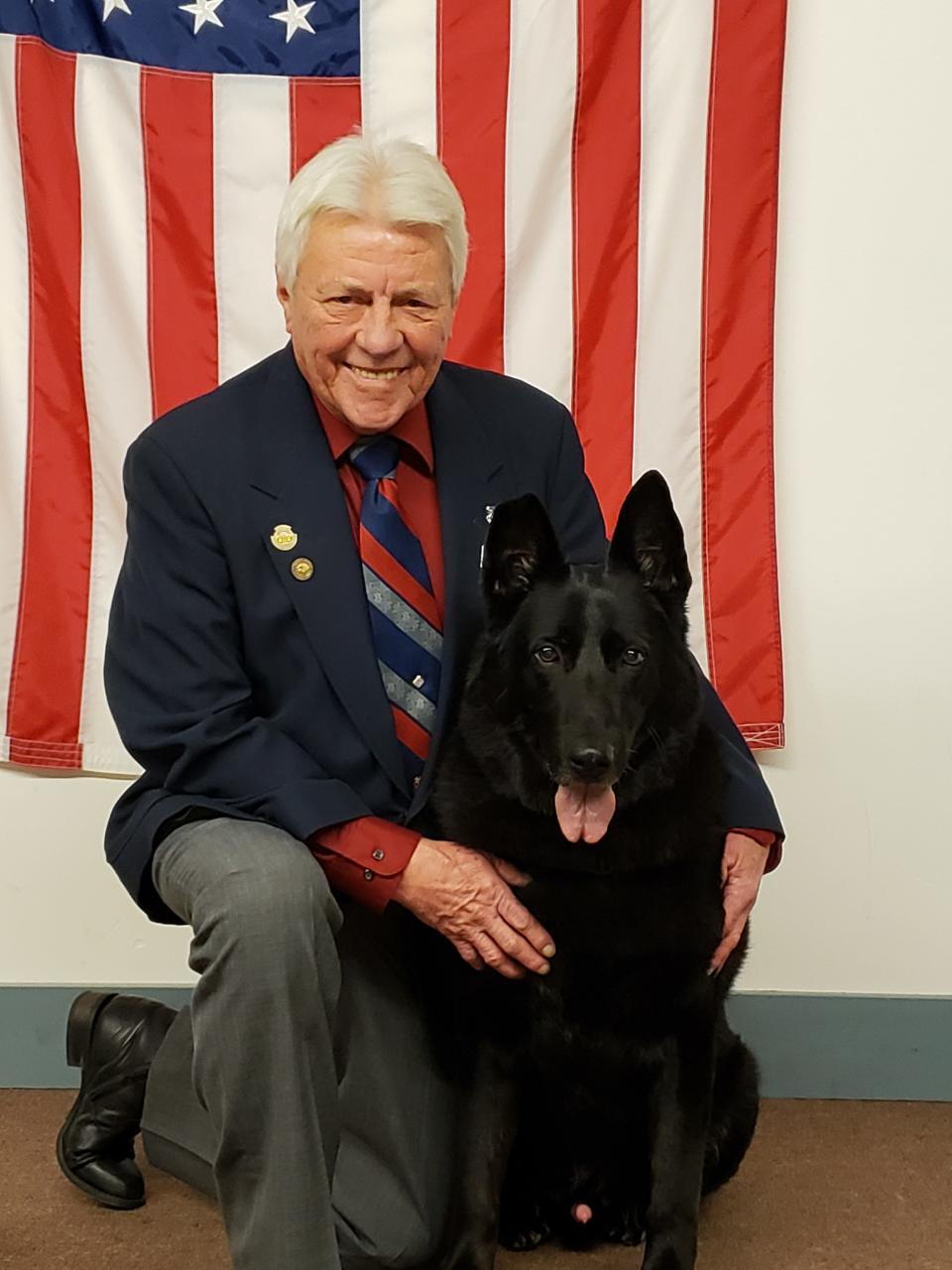 John Meeks with Sgt. 1st Class Brutusz, who was a bomb-sniffing dog for the U.S. Army stationed at Schofield Barracks, Hawaii. Meeks adopted Brutusz when he was retired in 2018 at age 7. Brutusz died on Dec. 6, 2022, and his ashes are interred at the Michigan War Dog Memorial cemetery.