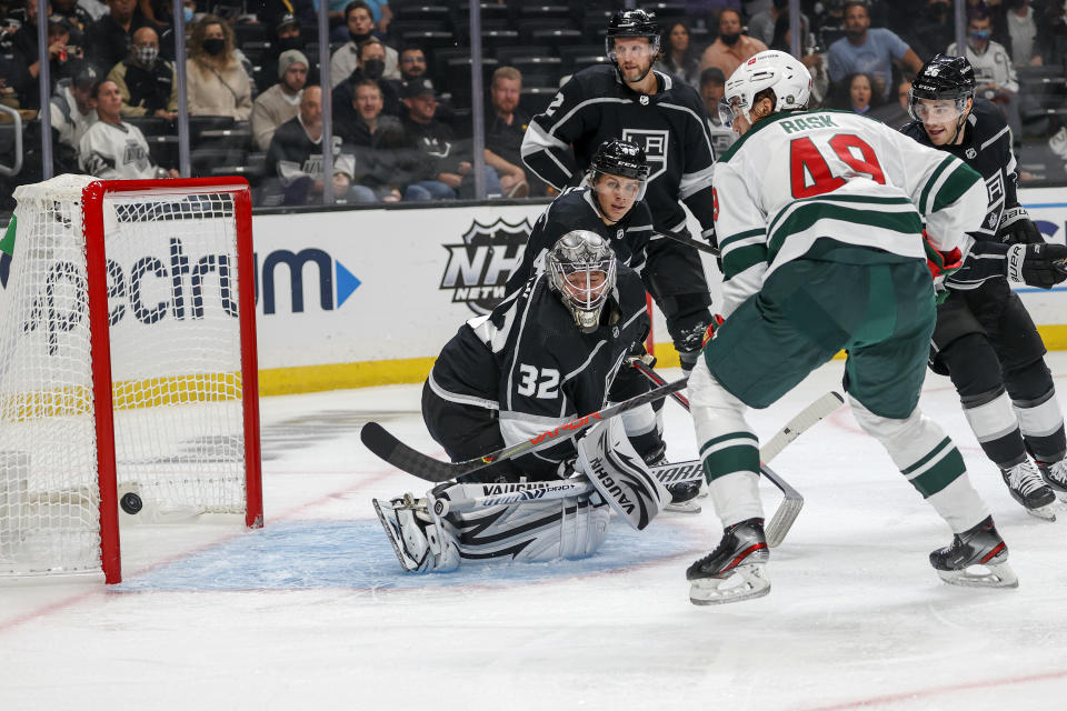 Los Angeles Kings goalie Jonathan Quick (32) gives up a goal to Minnesota Wild forward Victor Rask (49) during the second period of an NHL hockey game Saturday, Oct. 16, 2021, in Los Angeles. (AP Photo/Ringo H.W. Chiu)