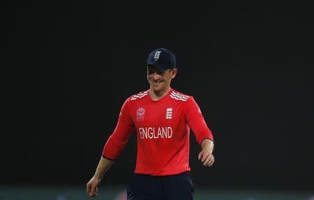 England's captain Eoin Morgan smiles as he walks off the field after their match. REUTERS/Adnan Abidi