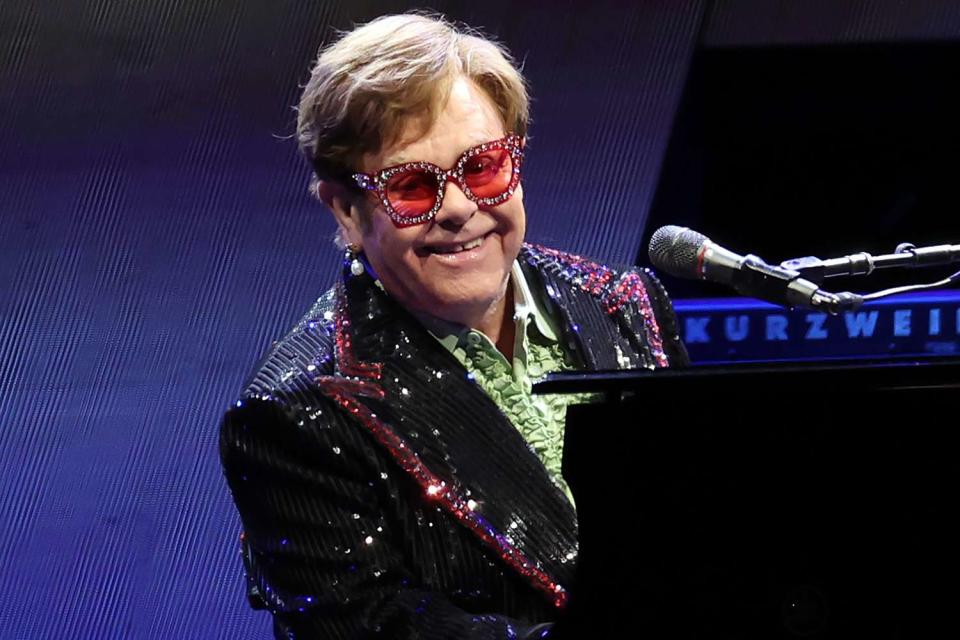 <p>Simone Joyner/Getty Images</p> Elton John performs in London in April 2023