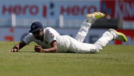 Cricket - India v Australia - Third Test cricket match - Jharkhand State Cricket Association Stadium, Ranchi, India - 16/03/17 - India's Ravichandran Ashwin dives to stop the ball. REUTERS/Adnan Abidi