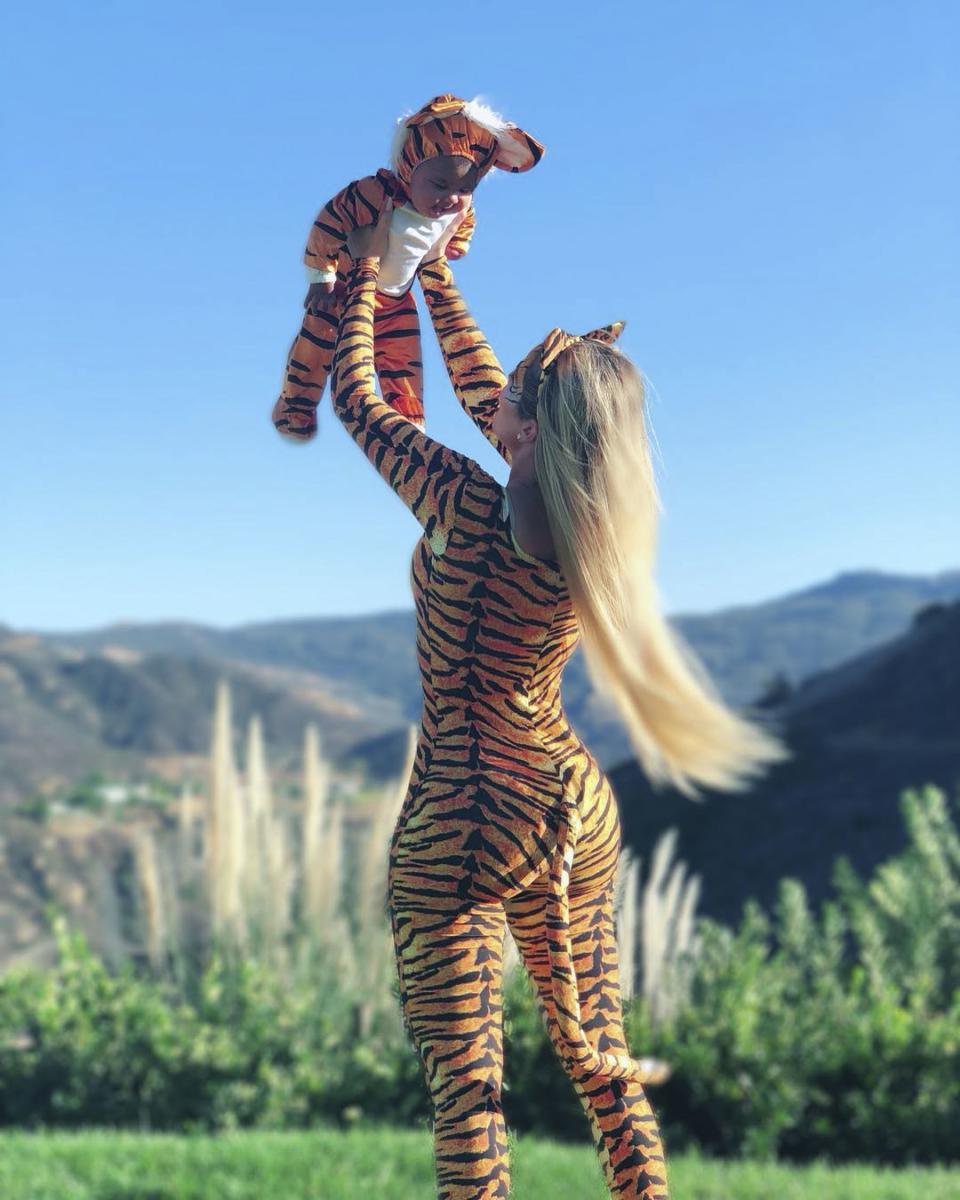 And the Halloween fun didn't stop there. Dressed in matching tiger costumes, True and Khloé did their best<em> Lion King </em>impression. 