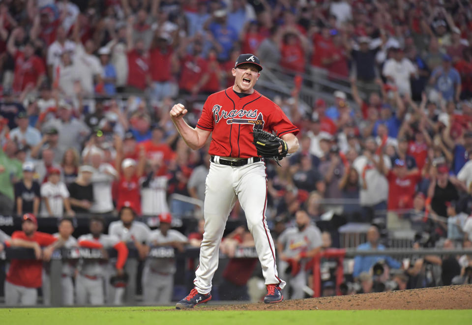 Atlanta Braves relief pitcher Mark Melancon reacts after he struck out St. Louis Cardinal' Kolten Wong to end Game 2 of a baseball National League Division Series on Friday, Oct. 4, 2019, in Atlanta. The Braves won 3-0. (Hyosub ShinAtlanta Journal-Constitution via AP)