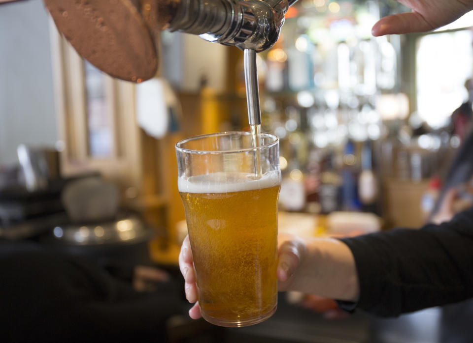 pouring a pint of beer from the draft