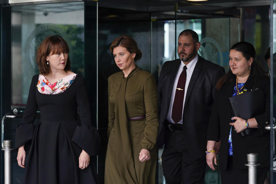 Olena Zelenska, second from left, spouse of Ukrainian's President Volodymyr Zelenskyy, walks out of the State Department, Monday, July 18, 2022 in Washington, after meeting with Secretary of State Antony Blinken in a closed-to-press meeting. Walking at right is Ukraine's Ambassador to the United States, Oksana Markarova. (AP Photo/Patrick Semansky)
