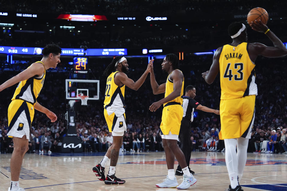 Indiana Pacers forwards Isaiah Jackson and Aaron Nesmith high five during the first half of Game 7 in an NBA basketball second-round playoff series against the New York Knicks, Sunday, May 19, 2024, in New York. (AP Photo/Julia Nikhinson)