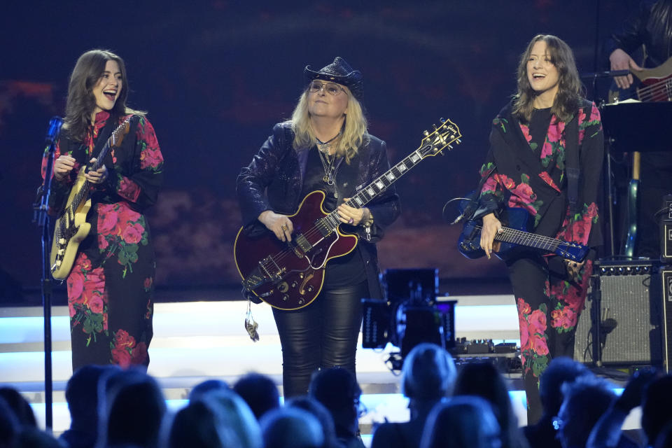 Rebecca Lovell of Larkin Poe, from left, Melissa Etheridge, and Megan Lovell of Larkin Poe perform during MusiCares Person of the Year honoring Jon Bon Jovi on Friday, Feb. 2, 2024, in Los Angeles. (AP Photo/Chris Pizzello)