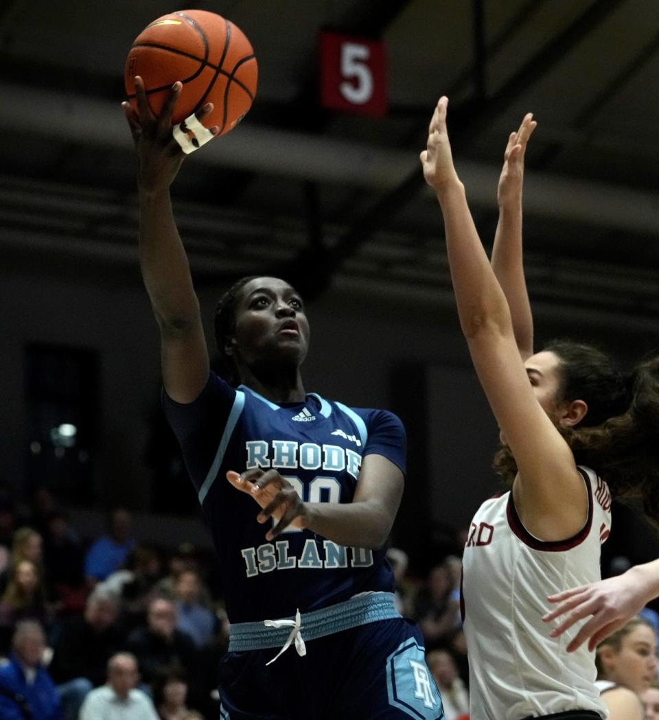 Mayé Touré lays the ball up and over Crimson defender Elena Rodriguez in first-half action Thursday night.