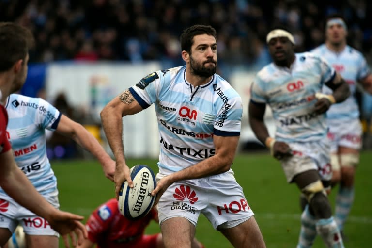 Racing Metro's fly-half Remi Tales passes the ball during a European Champions Cup rugby union match against the Llanelli Scarlets on January 17, 2016 at the Yves du Manoir stadium in Colombes