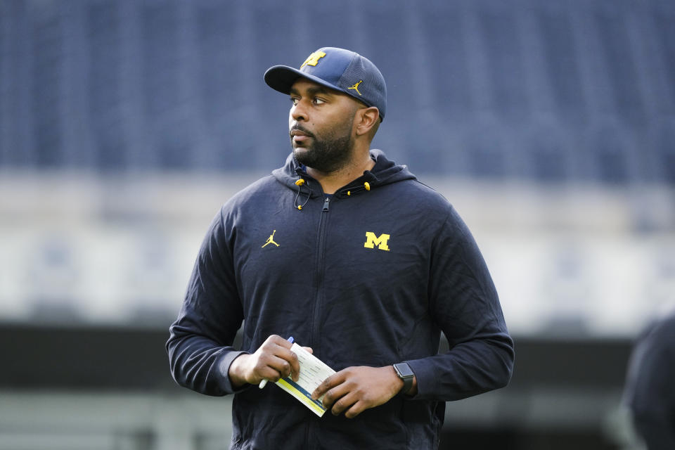 Michigan offensive coordinator Sherrone Moore watches an NCAA college football practice Saturday, Dec. 30, 2023, in Inglewood, Calif. Michigan is scheduled to play against Alabama on New Year's Day in the Rose Bowl, a semifinal in the College Football Playoff. (AP Photo/Ryan Sun)