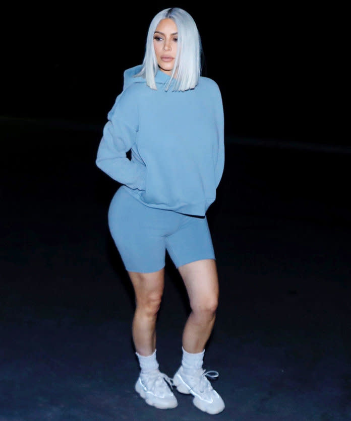 <p>The reality star matched her icy blue hair to her hoodie and bike shorts while out in Calabasas, Calif. High socks and Yeezy sneakers completed her athleisure look.</p>