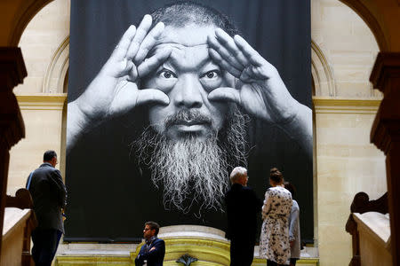 The face of the Chinese artist and free-speech advocate Ai Weiwei is pictured on the poster of an exhibition titled "Ai Weiwei: By the way, it's always the others" at the Musee Cantonal des Beaux Arts in Lausanne, Switzerland September 20 2017. REUTERS/Pierre Albouy NO RESALES. NO ARCHIVE.