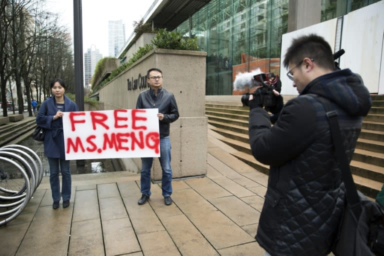 Supporters hold a sign calling for the release of Huawei's CFO Meng Wanzhou outside her bail hearing