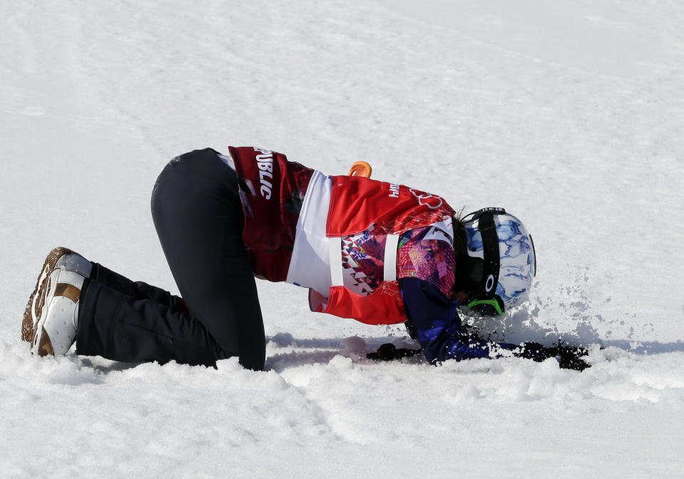 Czech Republic's Eva Samkova celebrates after taking the gold medal in the women's snowboard cross final at the Rosa Khutor Extreme Park, at the 2014 Winter Olympics, Sunday, Feb. 16, 2014, in Krasnaya Polyana, Russia. (AP Photo/Andy Wong)