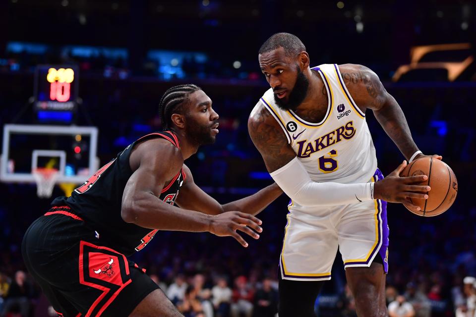 Mar 26, 2023; Los Angeles, California, USA; Los Angeles Lakers forward LeBron James (6) controls the ball againast Chicago Bulls forward Patrick Williams (44) during the first half at Crypto.com Arena.