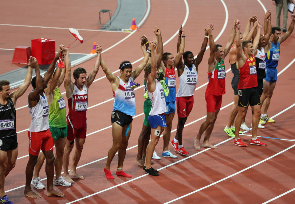 LONDON, ENGLAND - AUGUST 09: Athletes celebrate after the Men's Decathlon 1500m on Day 13 of the London 2012 Olympic Games at Olympic Stadium on August 9, 2012 in London, England. (Photo by Clive Brunskill/Getty Images)