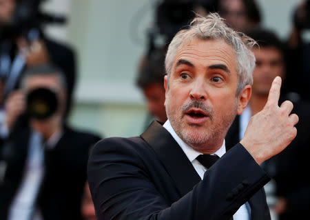 The 75th Venice International Film Festival - Screening of the film "Roma" competing in the Venezia 75 section - Red Carpet Arrivals - Venice, Italy, August 30, 2018 - Director Alfonso Cuaron gestures. REUTERS/Tony Gentile/File Photo