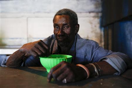 Felipe Cabral, 65, poses for a picture at the Mother Teresa of Calcutta eating center in Caracas April 9, 2014. REUTERS/Carlos Garcia Rawlins