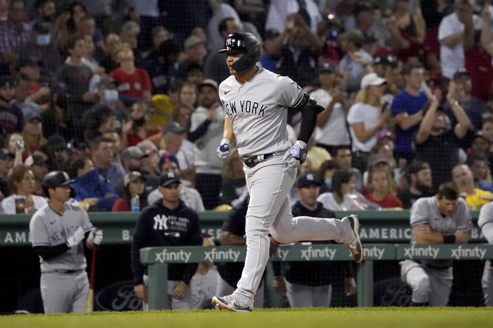 New York Yankees' Gleyber Torres rounds the bases after hitting a solo home run during the seventh inning of a baseball game against the Boston Red Sox at Fenway Park, Friday, Sept. 24, 2021, in Boston. (AP Photo/Mary Schwalm)