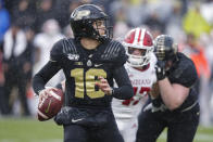 In this photo taken on Saturday, Nov. 30, 2019, Purdue quarterback Aidan O'Connell (16) throws against Indiana during the first half of an NCAA college football game in West Lafayette, Ind. (AP Photo/Michael Conroy)