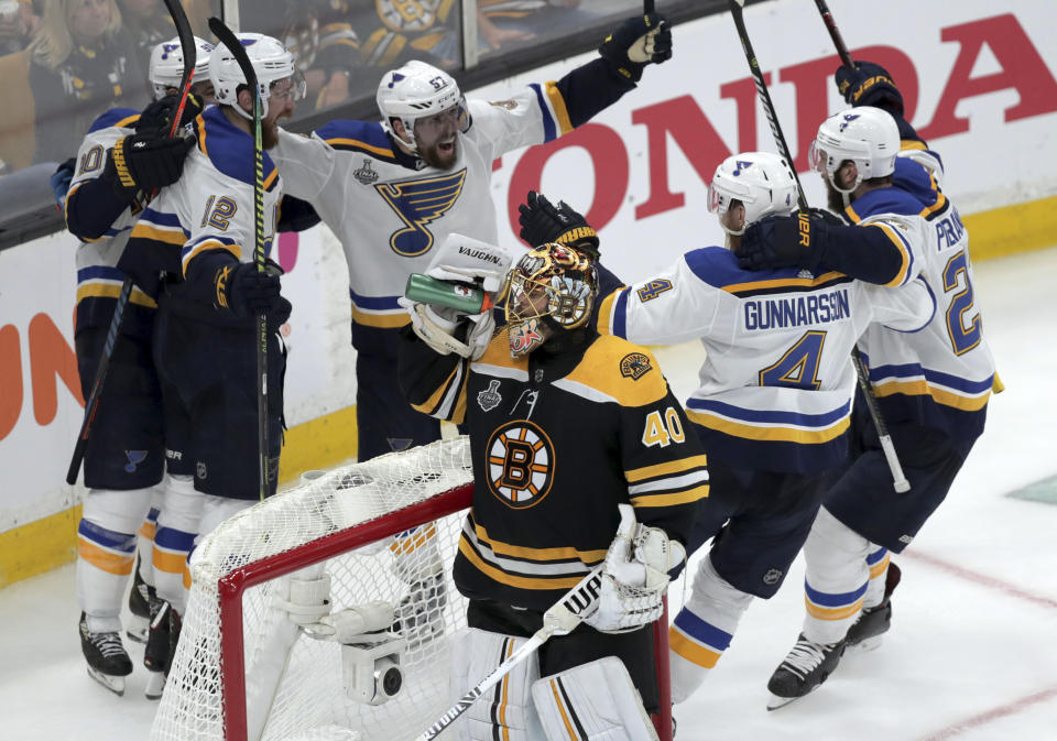 St. Louis Blues' Zach Sanford (12) celebrates his goal with teammates behind Boston Bruins goaltender Tuukka Rask (40), of Finland, during the third period in Game 7 of the NHL hockey Stanley Cup Final, Wednesday, June 12, 2019, in Boston. (AP Photo/Charles Krupa)