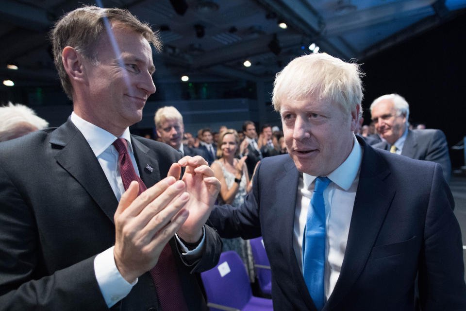 (left to right) Jeremy Hunt and Boris Johnson at the Queen Elizabeth II Centre in London as it was announced Mr Johnson is the new Conservative party leader, and will become the next Prime Minister.