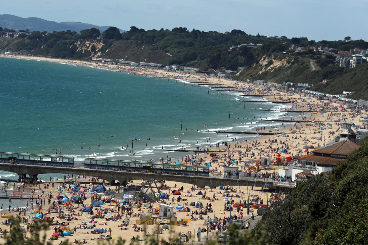 People on the beach at Bournemouth as the hot weather continues. (Photo by Steve Parsons/PA Images via Getty Images)
