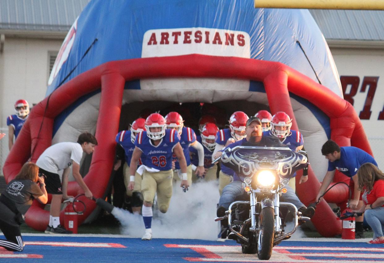 Martinsville makes grand entrance before Friday's Mid-State Conference game and senior night against Mooresville.