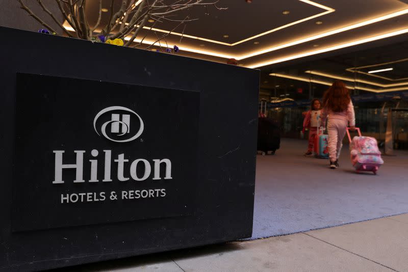 FILE PHOTO: People enter a Hilton hotel in Manhattan, New York City