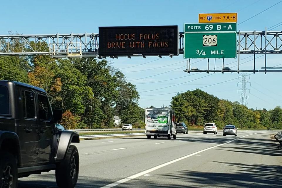 A New Jersey Department of Transportation roadside safety sign saying: "Hocus pocus drive with focus."