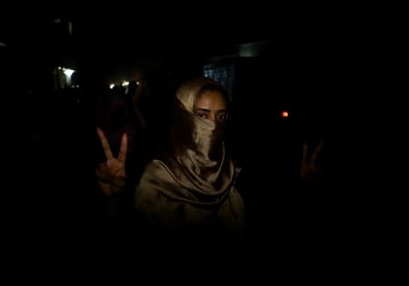 Sudanese woman makes victory sign during a demonstration in Khartoum