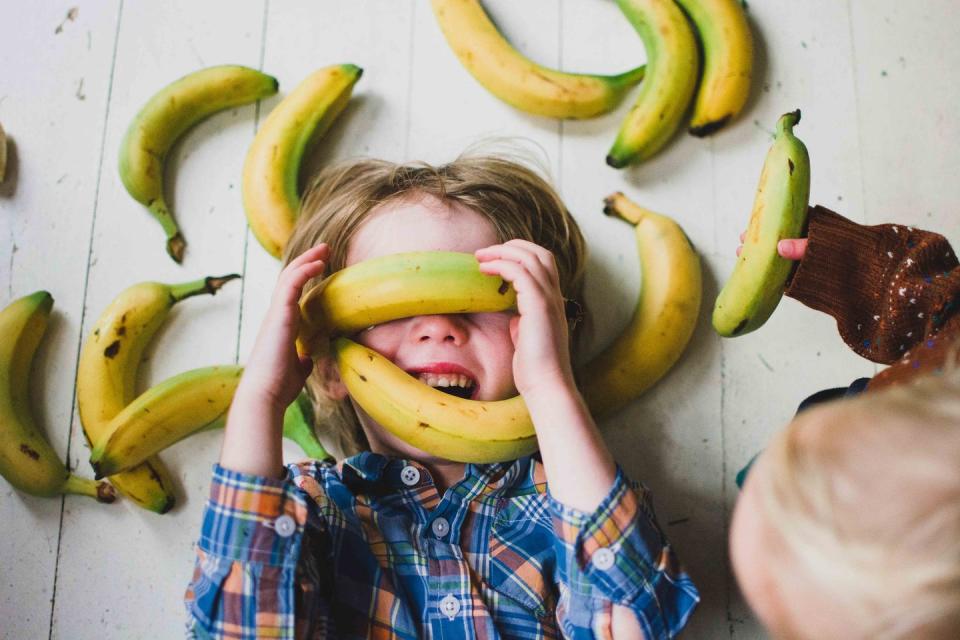 Children (2-3, 4-5) covered in bananas