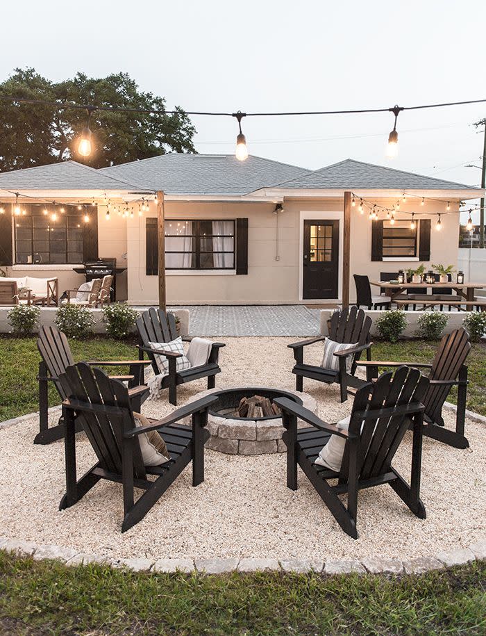 <p>We anticipate many summer nights spent around the fire. Make your backyard fire pit the ultimate hangout spot with Adirondack chairs, string lights, and s'mores.</p><p><strong>See more at</strong> <strong><a href="https://blog.jennasuedesign.com/2019/05/backyard-makeover-reveal-riverside-retreat/" rel="nofollow noopener" target="_blank" data-ylk="slk:Jenna Sue Design Co;elm:context_link;itc:0;sec:content-canvas" class="link ">Jenna Sue Design Co</a></strong><strong>.</strong></p><p><a class="link " href="https://go.redirectingat.com?id=74968X1596630&url=https%3A%2F%2Fwww.homedepot.com%2Fs%2Ffire%252520pits&sref=https%3A%2F%2Fwww.countryliving.com%2Fgardening%2Fnews%2Fg3404%2Fbackyard-string-lights%2F" rel="nofollow noopener" target="_blank" data-ylk="slk:SHOP FIRE PITS;elm:context_link;itc:0;sec:content-canvas">SHOP FIRE PITS</a></p>