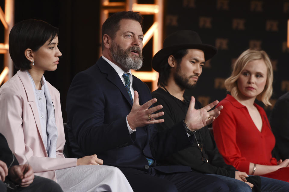 Nick Offerman, a cast member in the FX on Hulu limited series "Devs," second left, answers a question as fellow cast members, from left, Sonoya Mizuno, Jin Ha and Alison Pill look on at the 2020 FX Networks Television Critics Association Winter Press Tour, Thursday, Jan. 9, 2020, in Pasadena, Calif. (AP Photo/Chris Pizzello)
