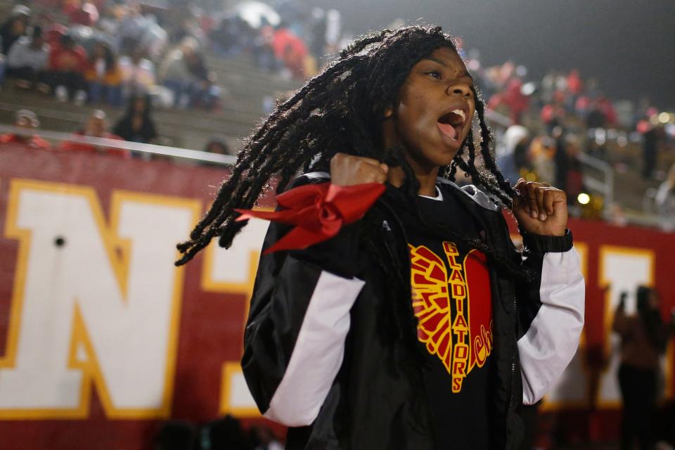 Clarke Central cheerleader roots on her team during an GHSA high school football between Cedar Shoals and Clarke Central in Athens, Ga., on Thursday, Oct. 28, 2021. Clarke Central won 42-21.