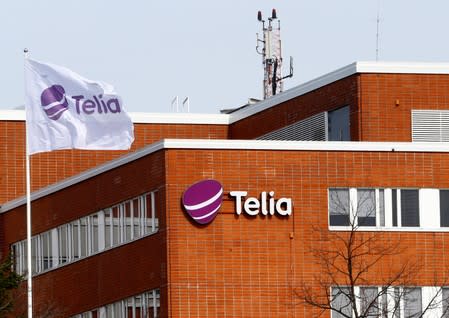 FILE PHOTO: A flag flutters at the Telia offices in Helsinki