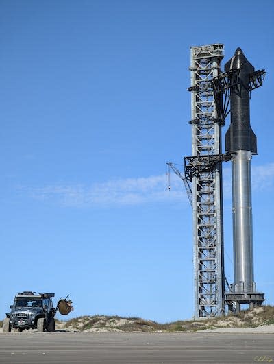 The full Starship stack comprises a Starship spacecraft (in black) on top of a rocket dubbed Super Heavy (in silver) and is nearly 400 feet (120 meters) tall. <a href="https://www.flickr.com/photos/195131646@N04/51912424446" rel="nofollow noopener" target="_blank" data-ylk="slk:Hotel Marmot/Flickr;elm:context_link;itc:0;sec:content-canvas" class="link ">Hotel Marmot/Flickr</a>, <a href="http://creativecommons.org/licenses/by-sa/4.0/" rel="nofollow noopener" target="_blank" data-ylk="slk:CC BY-SA;elm:context_link;itc:0;sec:content-canvas" class="link ">CC BY-SA</a>