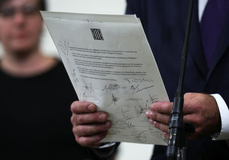 A declaration of independence is seen after it was signed by members of the Catalan regional government at the Catalan regional parliament in Barcelona, Spain, October 10, 2017. REUTERS/Albert Gea