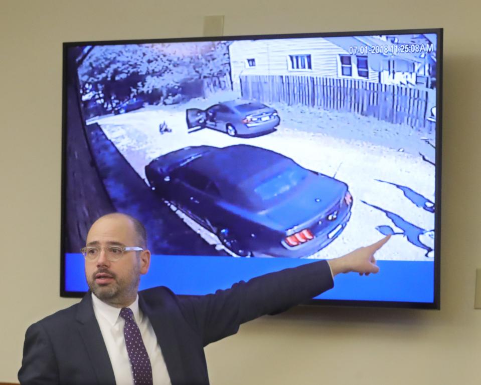 Elliot Kolkovich, then an assistant Summit County prosecutor, points to a surveillance camera photo during a murder trial in April 2022. Kolkovich has been appointed to fulfill the remainder of Summit County Prosecutor Sherri Bevan Walsh's term through the end of the year. Walsh retired because of health concerns.