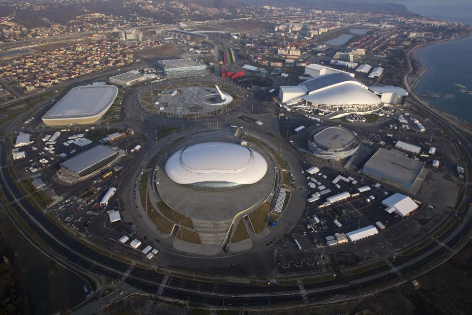 An aerial view from a helicopter shows the Olympic Park under construction in the Adler district of the Black Sea resort city of Sochi