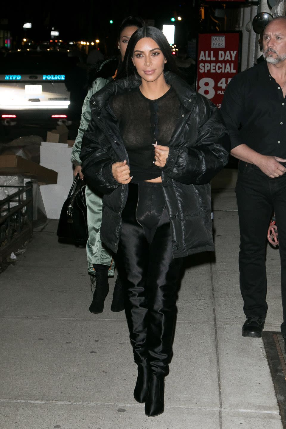 <p>In a sheer black henley, black puffer jacket, leggings, and hip-high Balenciaga boots while out in New York City</p>