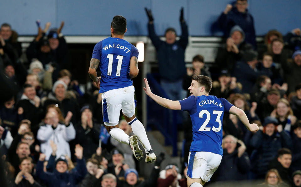 The £20 million signing Theo Walcott opened his Everton account with both of their goals in a 2-1 win over Leicester.