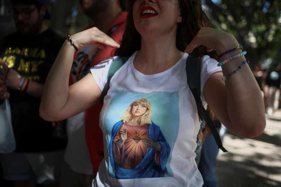 A Taylor Swift fan lines up for her concert using a t-shirt with Swift depicted as Mother Mary, at the Estadio Mas Monumental, in Buenos Aires, Argentina November 9, 2023. REUTERS/Tomas Cuesta