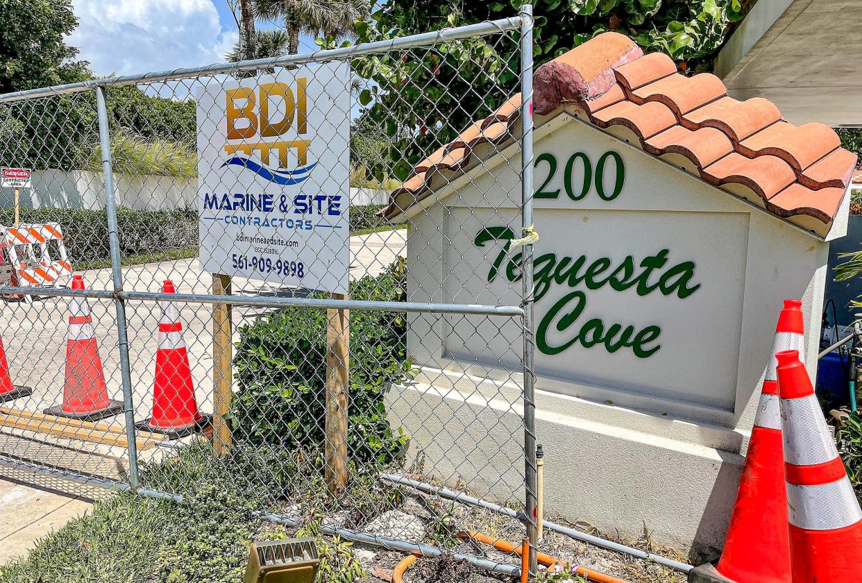 Construction fencing blocks the entrance to Tequesta Cove off Waterway Road near the Intracoastal on April 14, 2022. The 24-condo building was evacuated March 23 after inspectors deemed it unsafe.