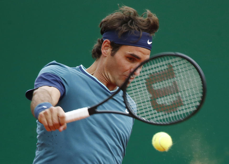 Roger Federer of Switzerland, returns the ball to Radek Stepanek Czech Republic during their match at the Monte Carlo Tennis Masters tournament in Monaco, Wednesday, April 16, 2014. (AP Photo/Michel Euler)