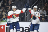 Florida Panthers center Aleksander Barkov, left, celebrates his goal with left wing Jonathan Huberdeau during the first period of an NHL hockey game against the Los Angeles Kings Thursday, Feb. 20, 2020, in Los Angeles. (AP Photo/Mark J. Terrill)