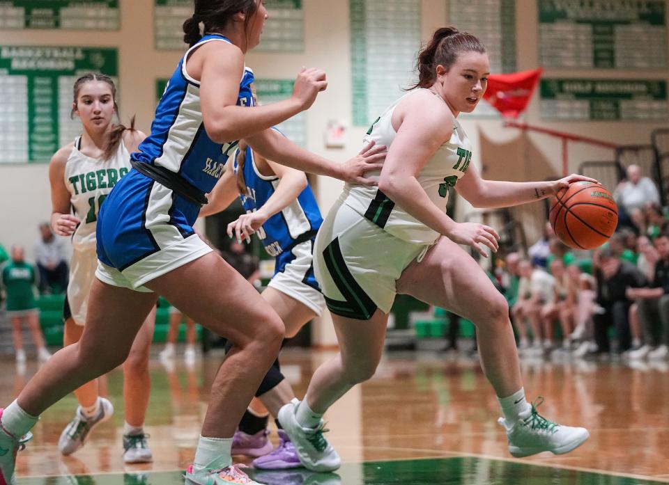 Triton Central Tigers Brooklyn Bailey (34) rushes up the court Saturday, Nov. 11, 2023, during the game at Triton Central High School in Fairland. The Eastern Hancock Royals defeated the Triton Central Tigers, 50-41.